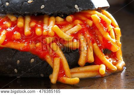Close Up Of Charcoal Bun Spaghetti Sandwich