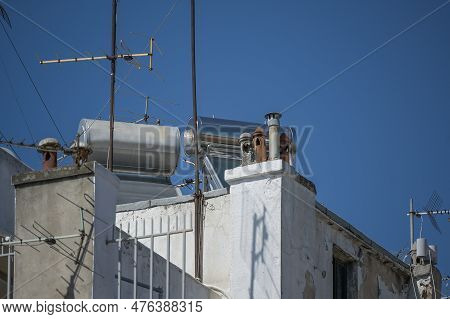 Thermosiphon Systems With Solar Collector And Water Tank On The Rooftop Of A High Apartment Building