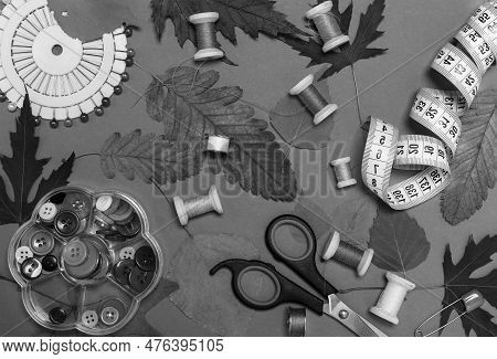 Black And White Sewing Kit. Threads On Bobbins, Centimeter Tape And Thimble.