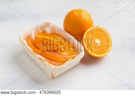 Wicker Birch Basket With Fresh Juicy Candied Oranges With Fresh Juicy Orange On A Light Gray Backgro