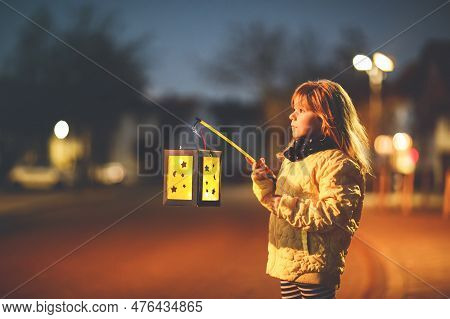 Little Preschool Kid Girl Holding Selfmade Traditional Lanterns With Candle For St. Martin Processio