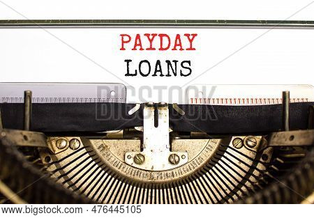 Payday Loans Symbol. Concept Words Payday Loans Typed On Beautiful Old Retro Typewriter. Beautiful W