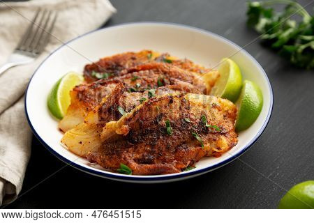 Homemade Pan Seared Tilapia On A Plate, Side View.