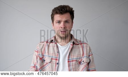 The Angry European Young Man Wearily Looks. He Is Without Strength And Energy