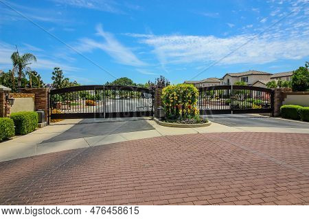 Entrance And Exit Metal Security Gates At Housing Subdivision