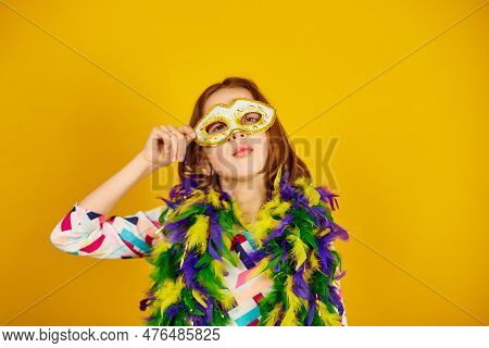 A Joyful Teenager Girl Wearing A Colorful Brazil Carnival Mask