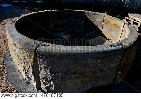 A Stonemason Repairs An Old Fountain. Connects Parts Using Steel Clips And Lime Cement. A Beautiful 
