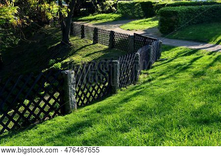 Old-fashioned Garden Fencing. Stone Posts With Mortise Directly From The Quarry, Between Which Is In