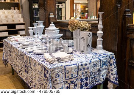 London, Uk -23 April, 2023: A Wide Variety Of White Plates Bowls And Mugs Lined Up For Sale At The L
