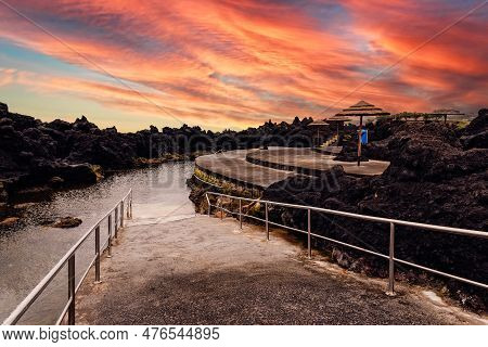 Natural Pools At Biscoitos During A Dramatic Sunset In The Coast Of Terceira Island