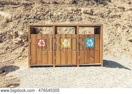Wooden Recycling Bins For Waste Sorting Outdoors. Garbage Bin In The Park