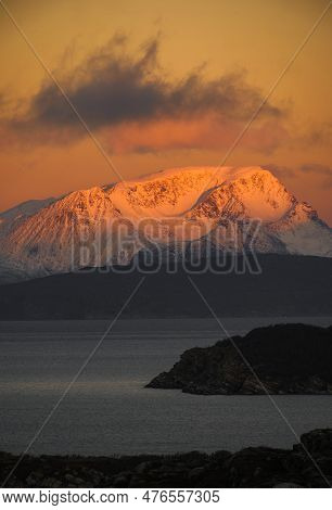 Dramatic Light And Clouds Over Snow Covered Mountain Peaks Of Northern Norway , Landscape And Nature