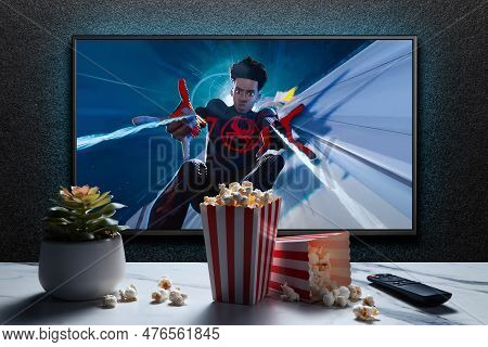 Tv Screen Playing Spider-man Across The Spider-verse Trailer Or Movie. Tv With Remote Control, Popco