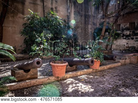 The Historic Cannons Of The Colonial City In This Courtyard In Santo Domingo, Dominican Republic.