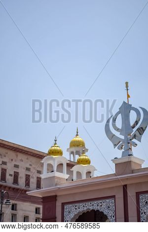 Khanda Sikh Holy Religious Symbol At Gurudwara Entrance With Bright Blue Sky Image Is Taken At Sis G