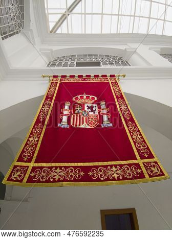 Merida, Spain - April 27th, 2023: Tapestry Embroidered With The Coat Of Arms Of Spain. Assembly Of E