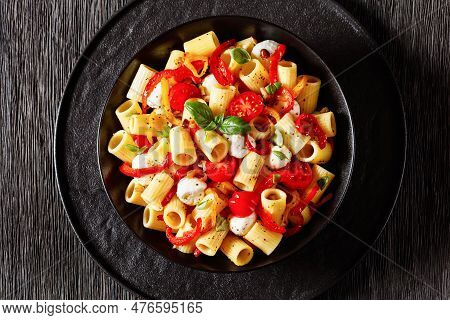 Roasted Pepper Tomato Mozzarella Pasta Salad In Black Bowl On Dark Oak Wood Table, Horizontal View F