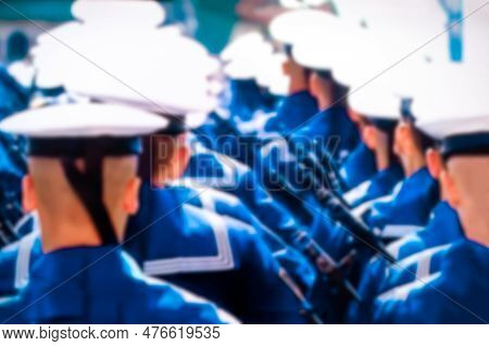 Sailors In White Peakless Caps March In Formation At The Victory Parade, Rear View, Blurred Focus.