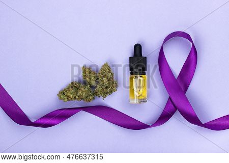 Dry Buds Of Medical Marijuana  And Glass Bottle With Cbd Oil Extract Next To A Purple Epilepsy Sign 