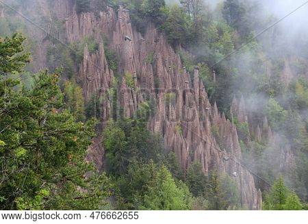 Landscape With The View Of The Earth Pyramids Renon In The Morning Fog Near The City Of Bolzano In T