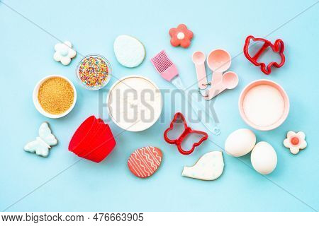 Easter Baking, Flour, Edds, Sugar And Gingerbread Cookies. Top View On Blue.