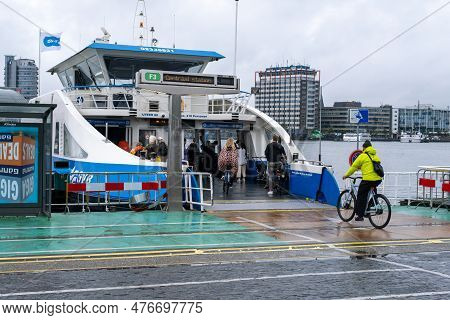 Amsterdam, The Netherlands - 8 September 2022: People Going Into A Gvb Ferryboat