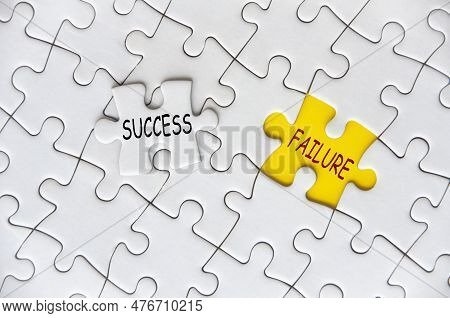 Success And Failure Text On Missing Jigsaw Puzzle. Success And Failure Concept.