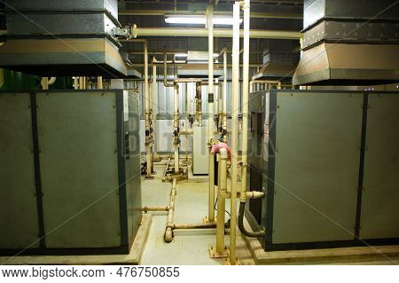 The Factory Walkway And Machine For Processing Metal Part Of Car. Warehouse And Store Keep Material 