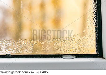 Wet Window Pane With Black Mold On Plastic. Water Condensation Problem. Dew Point. Winter Outside.