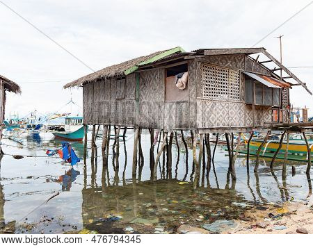 A Traditional Fisherman's Home In A Sea Of Junk At What Used To Be A Pristine Beach In The Village O