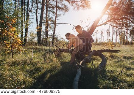 Happy Fathers Day. Dad And Son On A Walk In The Forest In Sunny Weather. Family Leisure. The Father 
