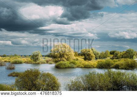 Countryside Landscape During Spring Flood Floodwaters. Bold Bright Blue Sky Above Nature Landscape D