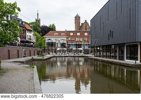 Hulst, Zeeland, The Netherlands - May 21, 2023 - Historical Buildings Reflecting In The Water Of The
