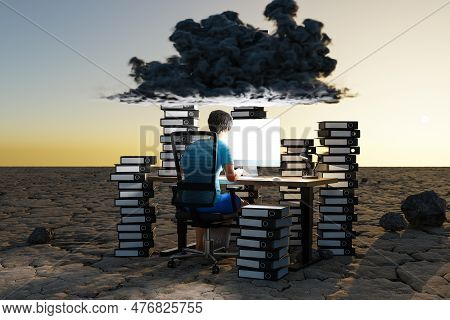 Man Sitting At Pc Office Workplace In Desert Environment With Huge Stacks Of Binders And Cloud Over 
