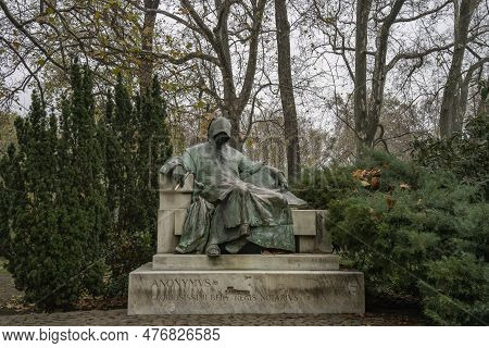 Budapest, Hungary - November 27th, 2022: The Statue Of Anonymus In The Yard Of Vajdahunyad Castle In