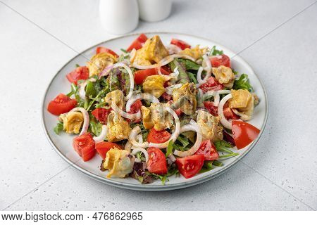 Warm Salad With Rapan (snails), Tomatoes, Onions, Leafy Vegetables And Olive Oil. Traditional Salad 
