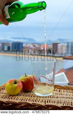 Traditional Natural Asturian Cider Made From fermented Apples In Wooden Barrels Should Be Poured Fro