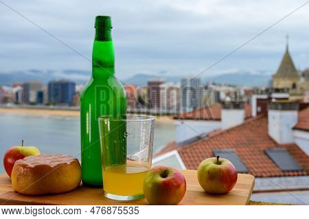 Traditional Natural Asturian Cider Made From fermented Apples In Wooden Barrels Should Be Poured Fro