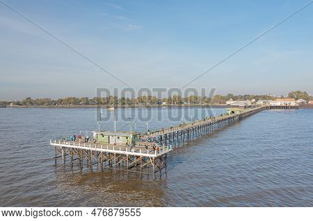 Buenos Aires, Argentina - May 16th, 2023: Fishermen On A Dock In The Rio De La Plata On The Quilmes 