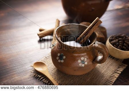 Authentic Homemade Mexican Coffee (cafe De Olla) Served In Traditional Handmade Clay Mug (jarrito De