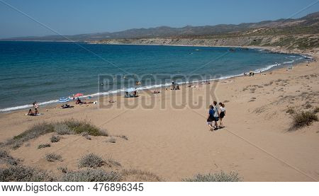 Akamas, Cyprus, July 29 2022: Summer Vacations On Tropical Beach. People In The Sea. Lara Beach, Aka