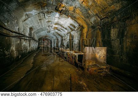 Old Abandoned Mine With Rusty Trolley Train.