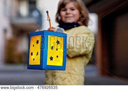 Closeup Of Little Preschool Kid Girl Holding Selfmade Traditional Lanterns With Candle For St. Marti