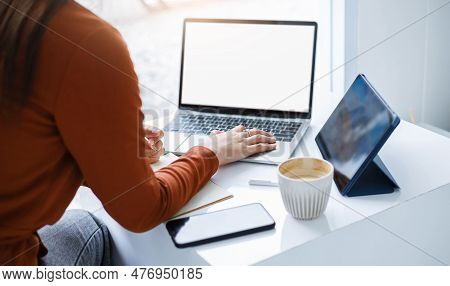 Asian Teenage Woman Study Online Class At Home With Laptop Computer And Tablet, Video Call With Teac