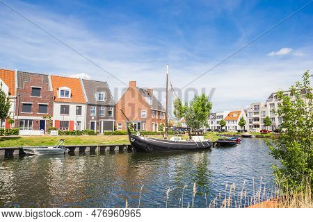 Harderwijk, Netherlands - May 22, 2022: Ships In The Canal Of The Waterfront Neighbourhood Of Harder