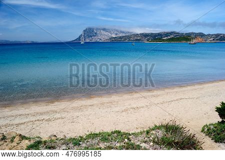 The Beach Of Capo Coda Di Cavallo, In Background The Island Of Tavolara