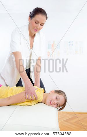 Femile Chiropractor doing adjustment on female patient