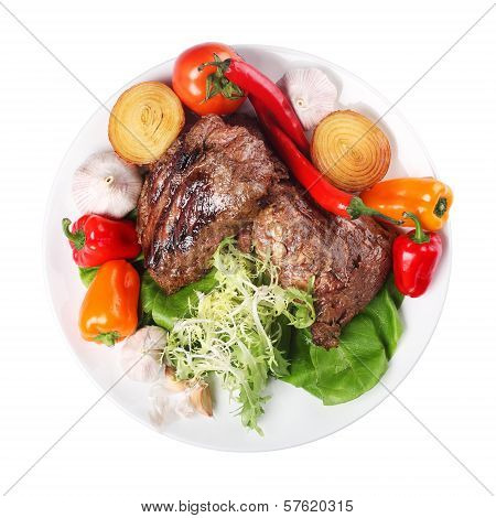 meat with vegetables in a plate on  white background