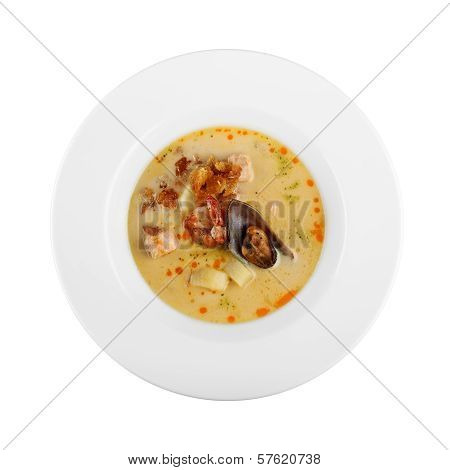 seafood soup in a plate on white background
