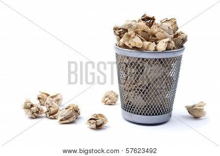 Iron Trash Bin Full Of Paper, Isolated On White Background